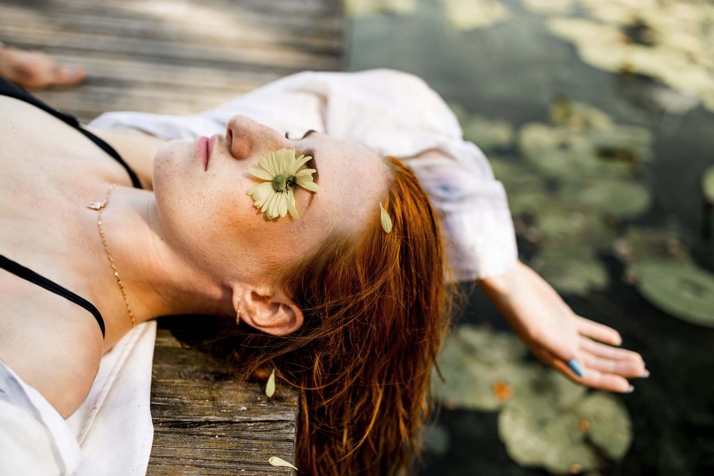 beautiful-young-woman-with-long-red-hair-in-the-wa-CB8NMU4.jpg